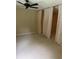 Spacious bedroom with neutral carpet, ceiling fan and curtains as a room divider at 2997 Happy Hollow Se Dr, Conyers, GA 30094