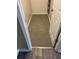 Carpeted walk-in closet in neutral tones with white trim at 2997 Happy Hollow Se Dr, Conyers, GA 30094