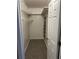 Walk-in closet with wire shelving and a white door at 2997 Happy Hollow Se Dr, Conyers, GA 30094