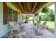 Charming front porch with stone flooring and comfortable seating at 2997 Happy Hollow Se Dr, Conyers, GA 30094