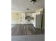Kitchen and Living room featuring laminate floors and white appliances at 2997 Happy Hollow Se Dr, Conyers, GA 30094