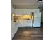 Kitchen boasts pristine white cabinets, countertops, and stainless steel appliances at 2997 Happy Hollow Se Dr, Conyers, GA 30094