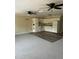 Open-concept space with sleek vinyl flooring in the kitchen and plush carpet in the living room at 2997 Happy Hollow Se Dr, Conyers, GA 30094