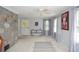 Bright living room featuring stone accent wall and neutral carpeting at 2997 Happy Hollow Se Dr, Conyers, GA 30094