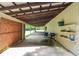 Covered outdoor patio featuring space for grilling and storage shelves at 2997 Happy Hollow Se Dr, Conyers, GA 30094