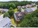 Aerial view showcases the home's backyard, deck, and landscaping within the neighborhood at 3610 Chestnut Meadows Dr, Douglasville, GA 30135