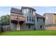 Backyard view of the house highlighting the spacious deck and architectural details at 3610 Chestnut Meadows Dr, Douglasville, GA 30135