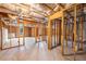 Unfinished basement with concrete floor, exposed ceiling insulation, and wood framing at 3610 Chestnut Meadows Dr, Douglasville, GA 30135