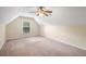 Neutral bedroom with a ceiling fan, an A-frame wall and a window with blinds at 3610 Chestnut Meadows Dr, Douglasville, GA 30135