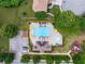 Aerial view of a community pool, lounge seating, a playground, and a parking area at 3610 Chestnut Meadows Dr, Douglasville, GA 30135