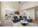 Bright living room with large windows, plush seating, and an open floor plan and a kitchen view at 3610 Chestnut Meadows Dr, Douglasville, GA 30135