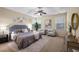 Spacious main bedroom with tray ceiling, neutral tones, and ample natural light at 3610 Chestnut Meadows Dr, Douglasville, GA 30135