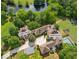 Aerial view of main house and guest house, showing pool, manicured yard, and other amenities at 4935 Stablegate Ct, Cumming, GA 30028