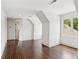 Bonus room featuring neutral colors, hardwood floors, and bright natural light at 4935 Stablegate Ct, Cumming, GA 30028