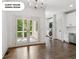 The dining room features hardwood floors, a modern chandelier, and French doors leading to a deck at 4935 Stablegate Ct, Cumming, GA 30028