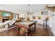 Bright game room with a stone fireplace, pool table, built-in cabinets, and hardwood flooring at 4935 Stablegate Ct, Cumming, GA 30028