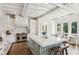 Bright kitchen featuring a large center island, farmhouse sink, stainless steel appliances, and custom cabinets at 4935 Stablegate Ct, Cumming, GA 30028