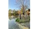 A Gathering enjoys the serene pond, adding to the charm of the property at 4935 Stablegate Ct, Cumming, GA 30028
