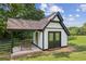 Exterior of a modern and well-maintained shed sitting on a lush green lot at 4935 Stablegate Ct, Cumming, GA 30028