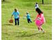 having fun in a large grassy yard during an easter egg hunt at 4935 Stablegate Ct, Cumming, GA 30028