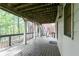 Exterior view of back porch with access to backyard surrounded by trees at 920 Waters Reach Ct, Alpharetta, GA 30022