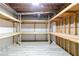 Unfinished basement with built in storage shelves and modern flooring at 920 Waters Reach Ct, Alpharetta, GA 30022