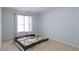 Bedroom featuring neutral paint color and natural light from a window at 920 Waters Reach Ct, Alpharetta, GA 30022