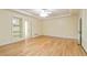 Large main bedroom featuring hardwood floors, a ceiling fan, and natural light from the windows at 920 Waters Reach Ct, Alpharetta, GA 30022