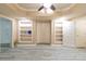 Neutral bedroom with gray wood floors and multiple doors and windows at 920 Waters Reach Ct, Alpharetta, GA 30022