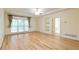 Large main bedroom featuring hardwood floors, a ceiling fan, and access to natural light at 920 Waters Reach Ct, Alpharetta, GA 30022