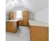 Bonus room with an island, built in counterspace and lots of storage cabinets, ceiling fan, and lots of light at 920 Waters Reach Ct, Alpharetta, GA 30022