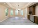 Dining area featuring gray wood floors, neutral walls and a mini bar at 920 Waters Reach Ct, Alpharetta, GA 30022