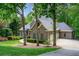 Charming brick home with a well-manicured lawn and mature trees, offering great curb appeal at 920 Waters Reach Ct, Alpharetta, GA 30022