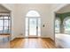 Bright entryway featuring hardwood floors, a decorative glass door, and open access to other rooms at 920 Waters Reach Ct, Alpharetta, GA 30022