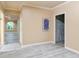 Hallway featuring modern flooring and doorway leading into other living spaces at 920 Waters Reach Ct, Alpharetta, GA 30022
