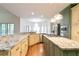 Gourmet kitchen featuring granite countertops, stainless appliances, and a functional center island at 920 Waters Reach Ct, Alpharetta, GA 30022