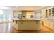 Spacious kitchen with stainless steel appliances, granite countertops, and a large island with pendant lighting at 920 Waters Reach Ct, Alpharetta, GA 30022
