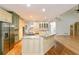 Spacious kitchen with stainless steel appliances, granite countertops, and a large island with pendant lighting at 920 Waters Reach Ct, Alpharetta, GA 30022