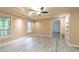 Well-lit bedroom with neutral walls and ceiling fan, complemented by a large window at 920 Waters Reach Ct, Alpharetta, GA 30022