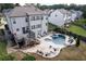 Backyard with stone patio, in-ground pool, hot tub, deck and plenty of space for entertaining at 108 Fountain Oak, Villa Rica, GA 30180