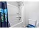 This bathroom features a shower and tub combination with white tile surround and unique curtain at 108 Fountain Oak, Villa Rica, GA 30180