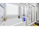 Bright bathroom featuring a soaking tub and glass enclosed shower, with tile surround at 108 Fountain Oak, Villa Rica, GA 30180