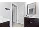 Bright bathroom features a modern vanity with a white countertop and decorative mirror at 108 Fountain Oak, Villa Rica, GA 30180