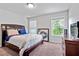 Bedroom with a bed, carpeted floors, natural light, and furniture at 108 Fountain Oak, Villa Rica, GA 30180