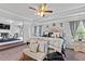 Spacious primary bedroom with tray ceiling, ceiling fan, and adjoining sitting area at 108 Fountain Oak, Villa Rica, GA 30180