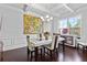 Bright dining room with coffered ceiling, hardwood floors, and modern furniture at 108 Fountain Oak, Villa Rica, GA 30180