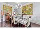 Elegant dining room with hardwood floors, modern chandelier, and stylish decor at 108 Fountain Oak, Villa Rica, GA 30180