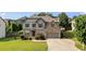 Beautiful two-story home with manicured lawn, gray siding, brick accents, and a two-car garage at 108 Fountain Oak, Villa Rica, GA 30180