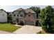 Stunning two-story home with landscaped yard, gray siding, brick accents, and a two-car garage at 108 Fountain Oak, Villa Rica, GA 30180