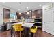 Modern kitchen with dark cabinets, granite countertops, stainless appliances, and a center island with seating at 108 Fountain Oak, Villa Rica, GA 30180